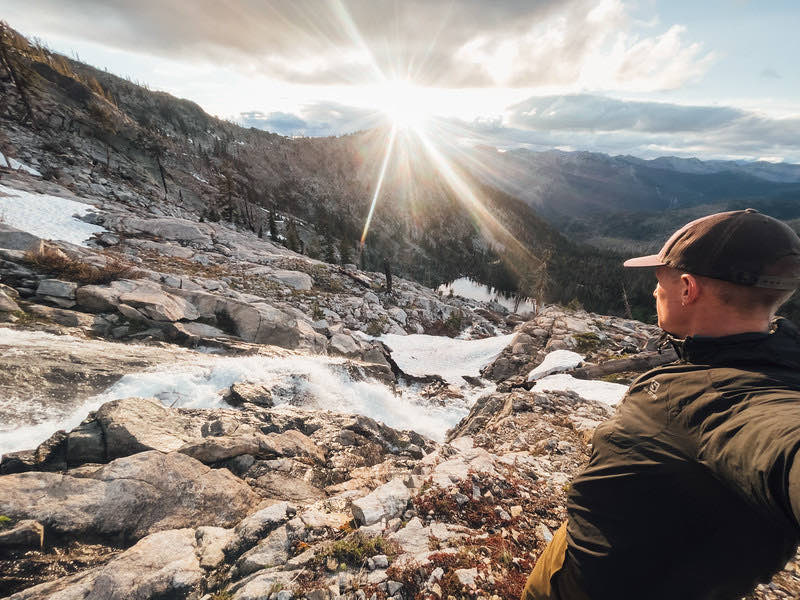 Sunburst over a rocky basin near Big Blue Lake